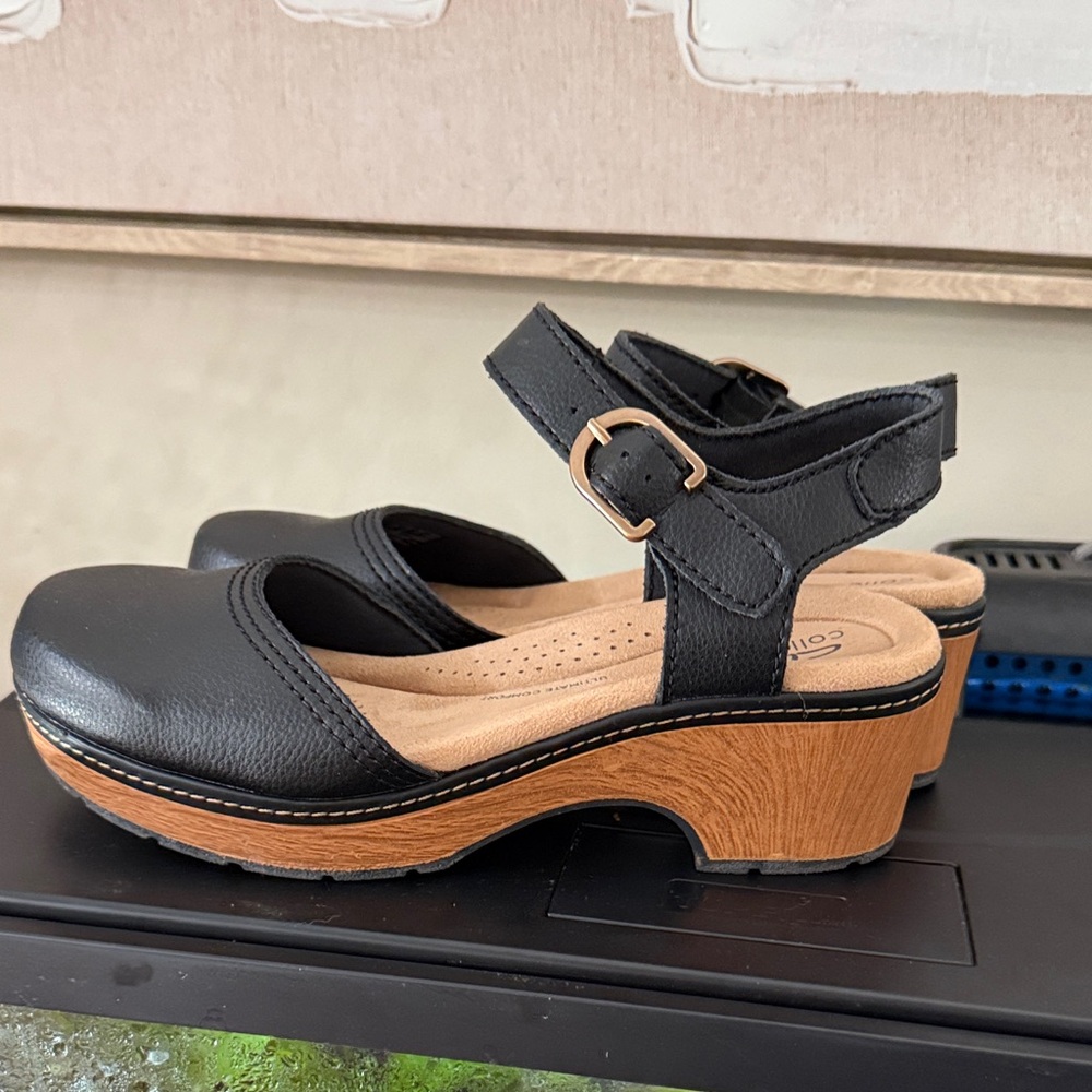 Clarks Black Leather Mules with Brown Sole